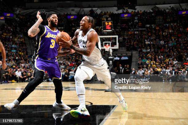 DeMar DeRozan of the San Antonio Spurs drives to the basket against Anthony Davis of the Los Angeles Lakers on November 3, 2019 at the AT&T Center in...