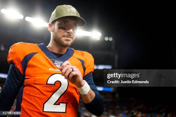 Quarterback Brandon Allen of the Denver Broncos walks on the field after the game against the Cleveland Browns at Empower Field at Mile High on...