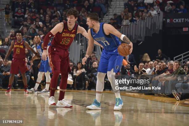 Luka Doncic of the Dallas Mavericks handles the ball against Cedi Osman of the Cleveland Cavaliers on November 3, 2019 at Rocket Mortgage FieldHouse...