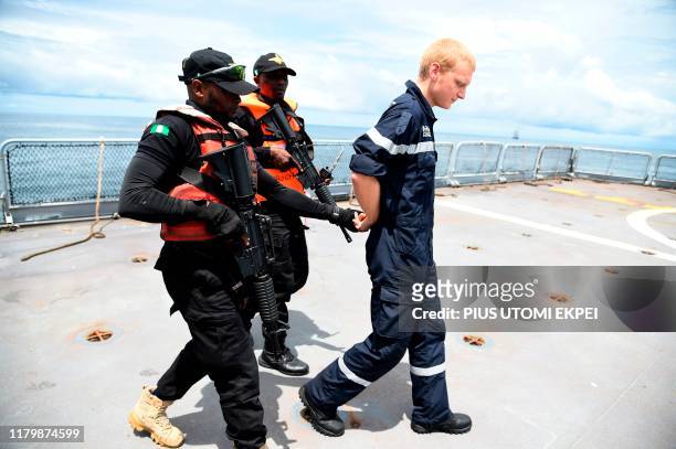 The Nigerian navy Special forces pretend to arrest a pirate in F735 Germinal French Frigate in a stage managed operations during the five-day joint...