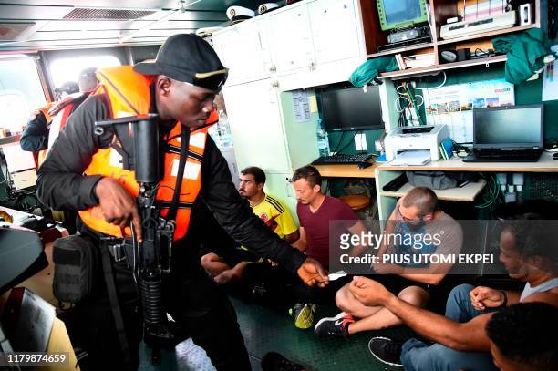 The Nigerian navy Special forces tries to identify arrested pirates in F735 Germinal French Frigate in a stage managed operations during the five-day...