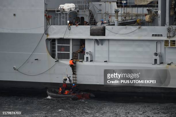 The Nigerian navy Special forces climb French logistics vessel to apprehend pirates in a stage managed operations during the five-day joint military...