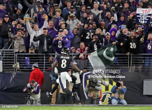 Baltimore Ravens quarterback Lamar Jackson high steps into the end zone for the first score of the game. The Baltimore Ravens host the New England...