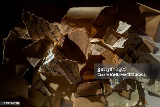 Torn or shredded Stasi documents earmarked for destruction after the fall of the Berlin wall in 1989 are seen in the former headquarters of the Stasi...
