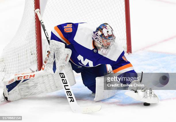 Semyon Varlamov of the New York Islanders protects the puck during the first period of their game against the Edmonton Oilers at the NYCB's LIVE...