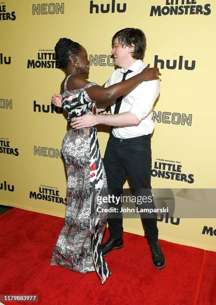 Lupita Nyong'o and Abe Forsythe attend "Little Monsters" New York premiere at AMC Lincoln Square Theater on October 08, 2019 in New York City.