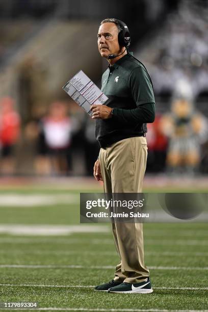 Head Coach Mark Dantonio of the Michigan State Spartans watches his team play against the Ohio State Buckeyes at Ohio Stadium on October 5, 2019 in...