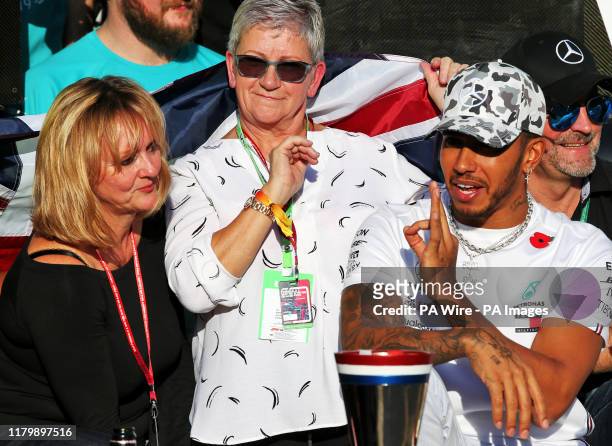 Mercedes driver Lewis Hamilton celebrates winning his sixth world championship with his mum Carmen Larbalestier after the United States Grand Prix at...