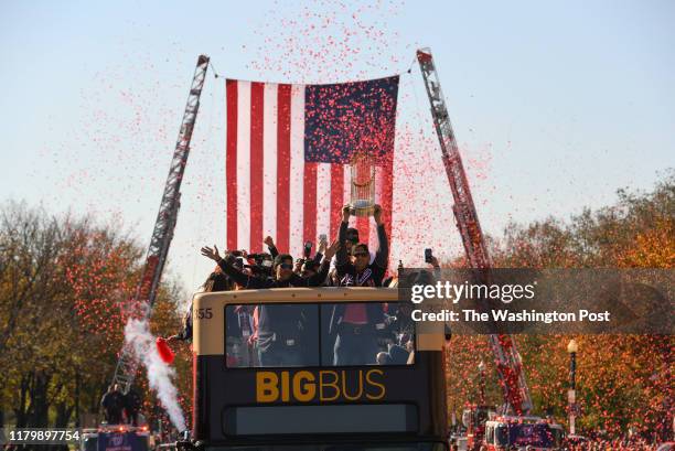 World Series Champions Washington Nationals manager Dave Martinez and Washington Nationals first baseman Ryan Zimmerman celebrate on a bus in a...