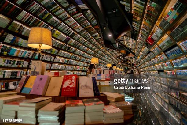 Zhongshuge bookstore, located in Yangzhou city, with mirrors and curves creating a mirage, to symbolize the water significance to the historical...