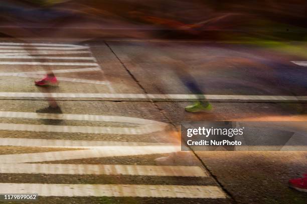 Long exposure shows runners competing at the New York City Marathon Sunday November 3rd, 2019. The NYC Marathon, which is the largest race in the...