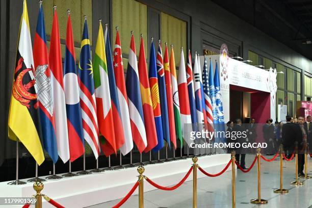 The national flags of the various countries attending the 35th Association of Southeast Asian Nations Summit are displayed in Bangkok on November 4,...