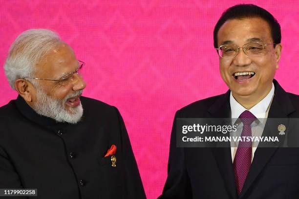 India's Prime Minister Narendra Modi shakes hands with China's Premier Li Keqiang during the 3rd Regional Comprehensive Economic Partnership Summit...