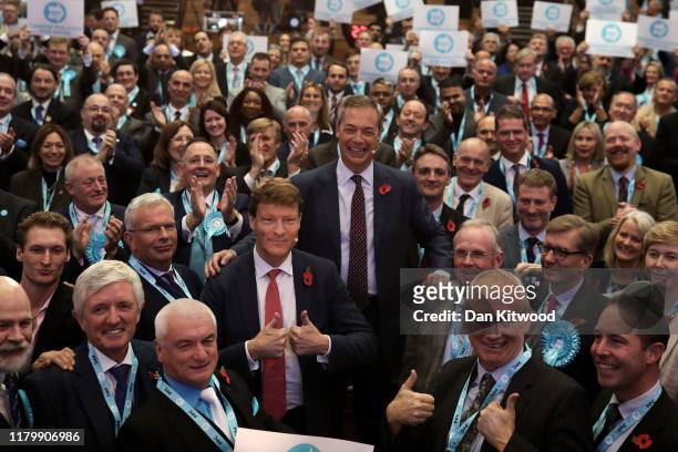Brexit Party candidates pose with leader Nigel Farage and Brexit Party chairman Richard Tice on November 4, 2019 in London, England. The Brexit party...