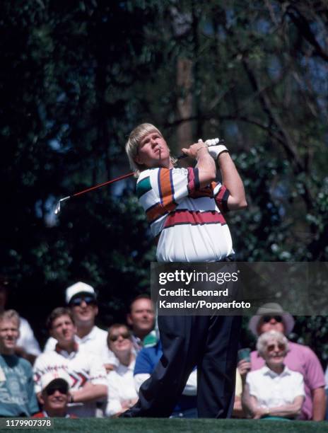 American golfer John Daly, smoking a cigarette, tees off during the US Masters Golf Tournament at the Augusta National Golf Club in Georgia, circa...