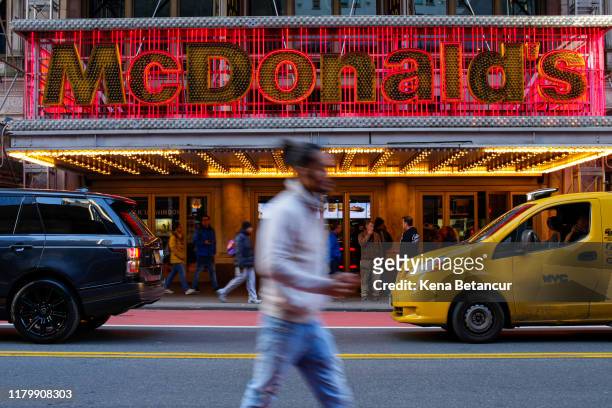 Person passes a McDonald's restaurant in Times Square following the firing of their CEO, Steve Easterbrook on November 4, 2019 in New York City....