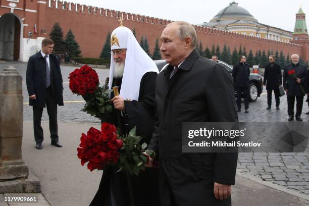 Russian President Vladimir Putin and Orthodox Patriarch Kirill attend a flowers laying ceremony at Red Square on November 4, 2019 in Moscow, Russia....