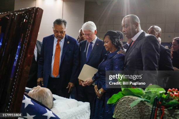 The Rev. Jesse Jackson, former President Bill Clinton, and Monica Conyers, the wife of former U.S. Congressman John Conyers Jr. , pay their respects...