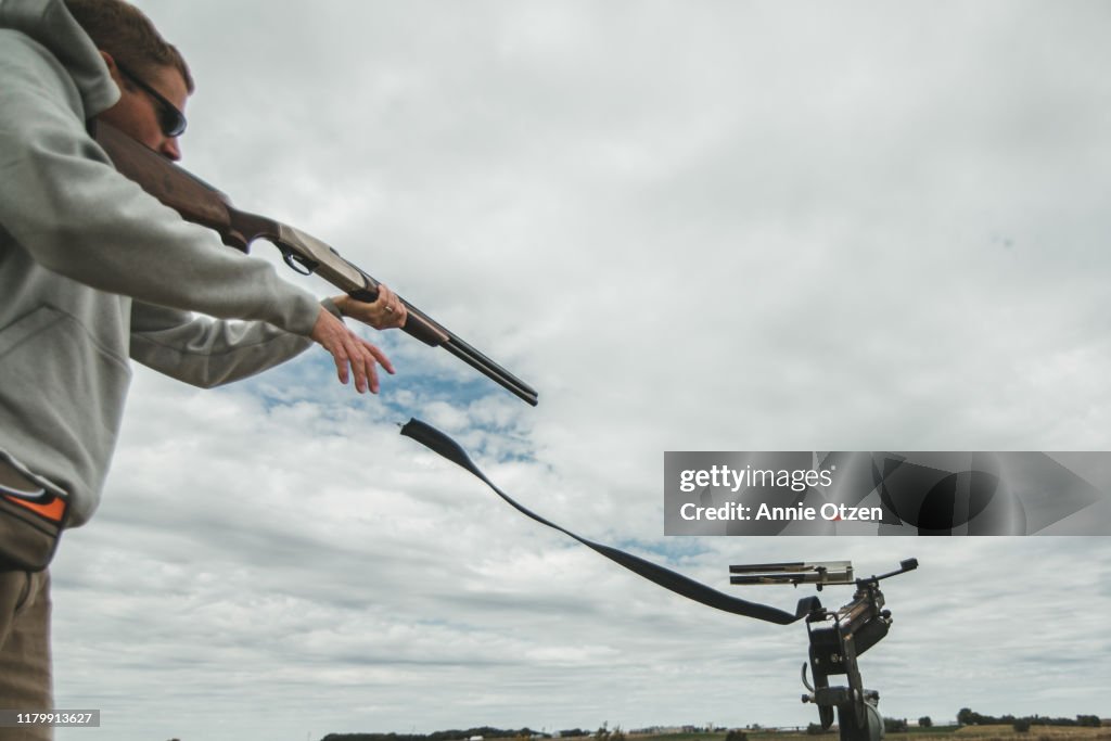 Man Launching clay pigeons