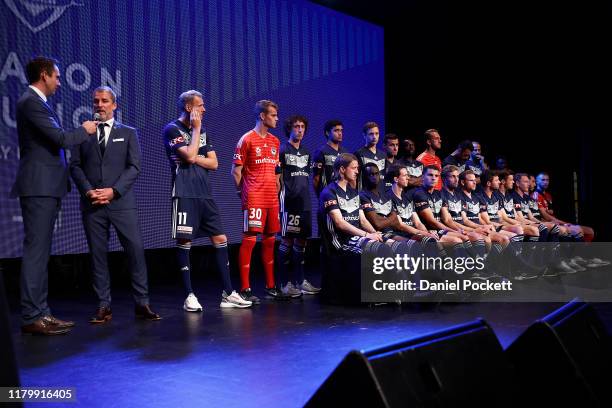 Coach Marco Kurz of the Victory speaks as the Victory players look on during a Melbourne Victory A-League media opportunity at their Business in...