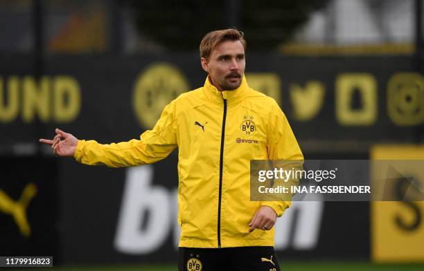 Dortmund's German defender Marcel Schmelzer reacts during a training session on the eve of the UEFA Champions League Group F football match BVB...