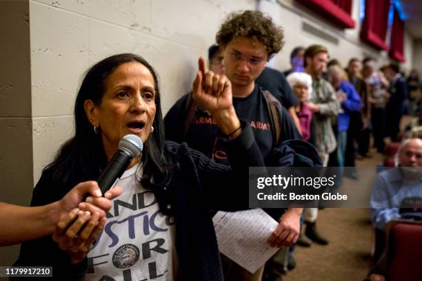 Ruth Rodriguez-Fay of Worcester asks a question during the town hall discussion with U.S. Senator Edward J. Markey and U.S. Representative Jim...
