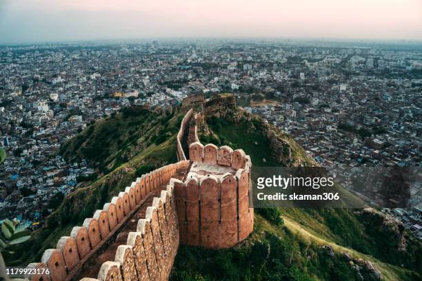 beautiful sunset landscape of nahargarh fort  ancient mughal walls and palace located middle of   jaipur india - akbar's tomb stock pictures, royalty-free photos & images