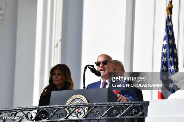 President Donald Trump and First Lady Melania Trump stand with General Manager Mike Rizzo as they welcome the 2019 World Series Champions, The...