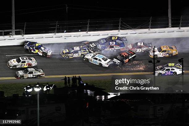 Mark Martin, driver of the Carquest/GoDaddy.com Chevrolet, Martin Truex Jr., driver of the NAPA Auto Parts Toyota, along with other drivers wreck off...