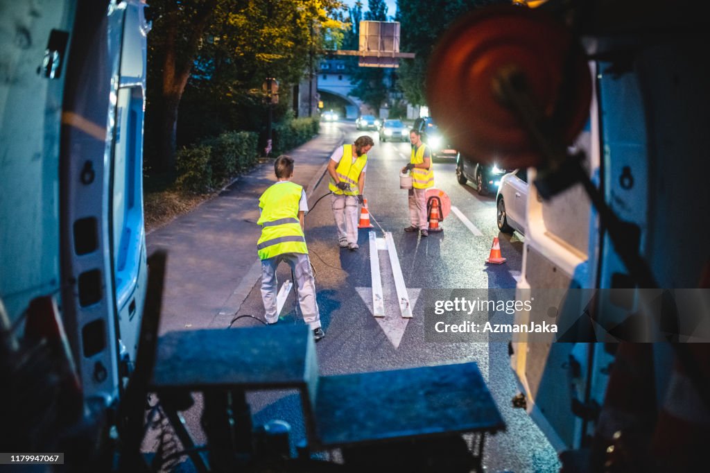 Interior View of Construction Crew Painting Street Marking