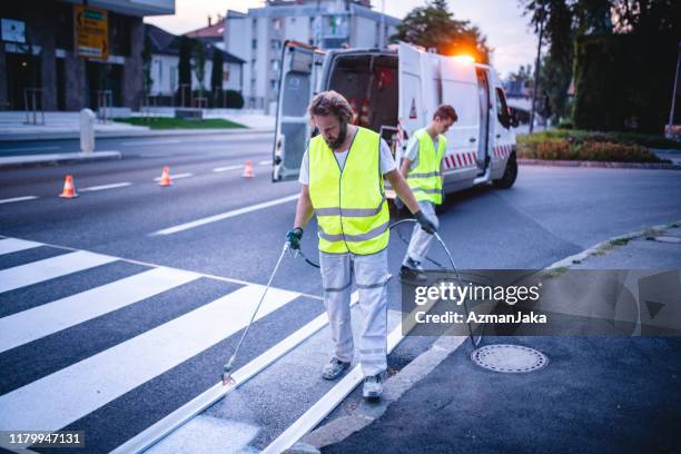 infrastructure upgrade occurring on european urban street - road marking stock pictures, royalty-free photos & images