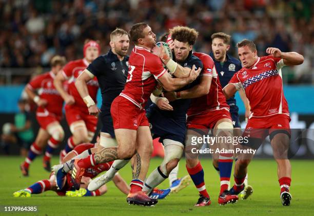 Duncan Taylor of Scotland is tackled during the Rugby World Cup 2019 Group A game between Scotland and Russia at Shizuoka Stadium Ecopa on October...