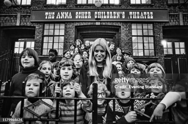 Irish educator and journalist Anna Scher with pupils outside her community-based drama school 'The Anna Scher Children's Theatre' on Barnsbury Road,...
