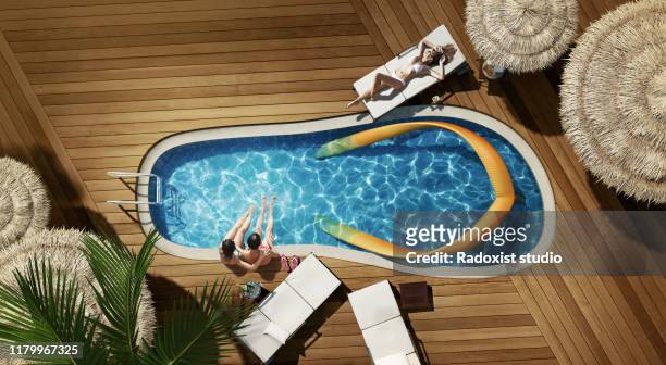 swimming pool in a shape of flip flop - sandales photos et images de collection