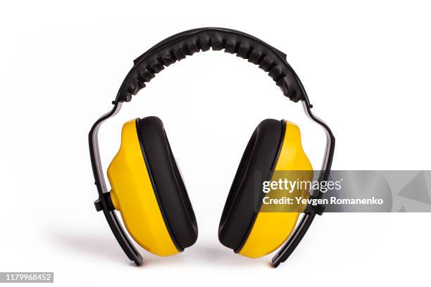 hearing protection yellow ear muffs, personal protective equipment, safety equipment isolated on white background - headphones isolated foto e immagini stock