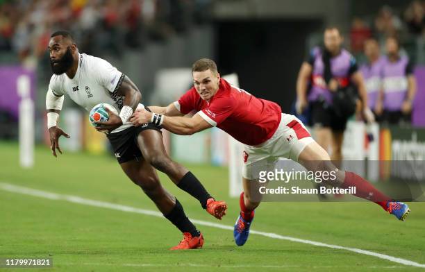 Semi Radradra of Fiji is tackled by George North of Wales during the Rugby World Cup 2019 Group D game between Wales and Fiji at Oita Stadium on...