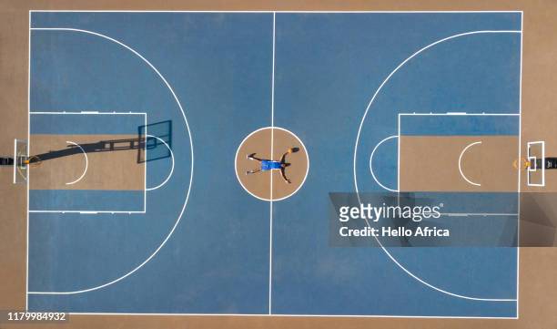 Aerial shot of basketball player lying outstretched on court