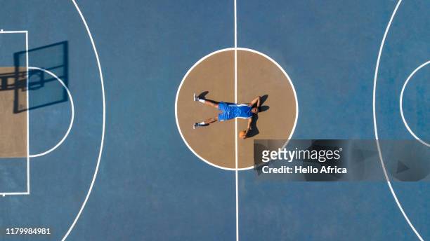 Aerial shot of basketball player relaxing on court