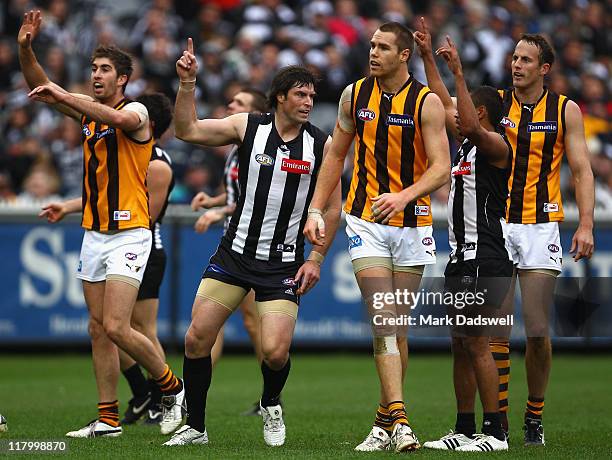 Leigh Brown of the Magpies celebrates a goal during the round 15 AFL match between the Collingwood Magpies and the Hawthorn Hawks at Melbourne...