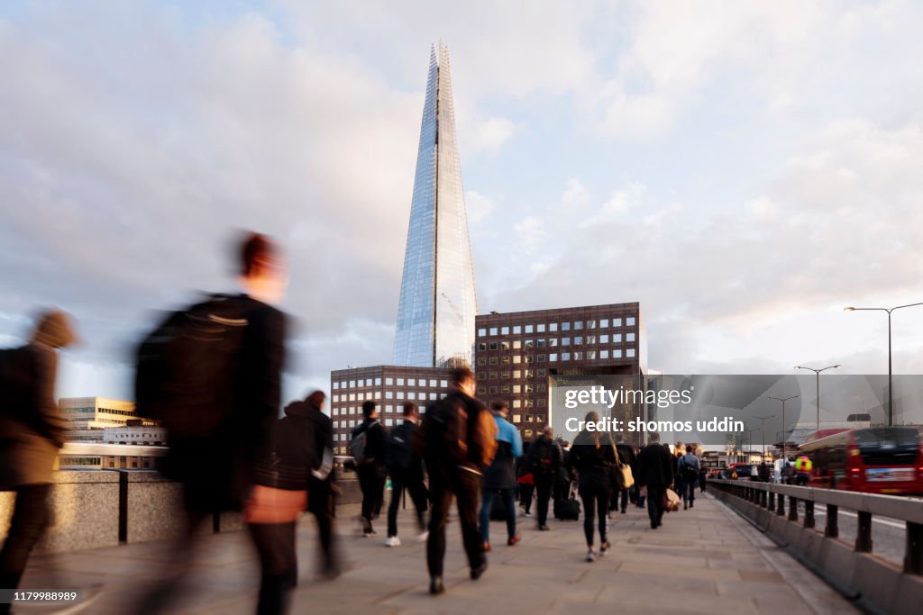 Rear view of city workers against London Southwark skyline