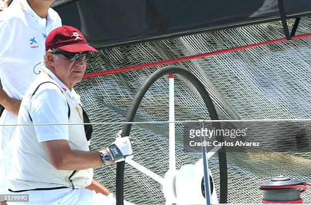 King Juan Carlos of Spain , on board of the "Bribon", attends the first day of 21st Sailing Trophy "Copa del Rey" July 29, 2002 in Palma de Mallorca,...