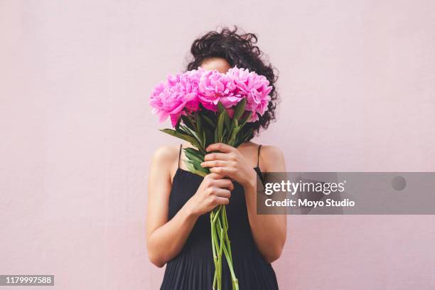 you don't need someone else to buy you flowers! - holding stock pictures, royalty-free photos & images