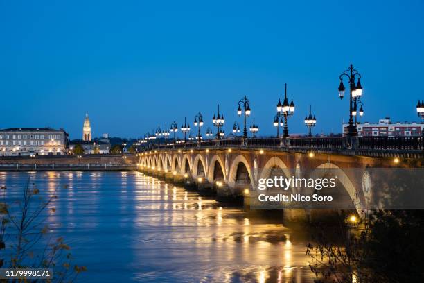 le pont de pierre at night (french bridge in bordeaux) - aquitaine stock pictures, royalty-free photos & images