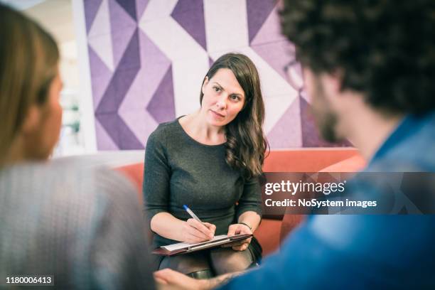 couple on meeting with counsellor - marriage counseling stock pictures, royalty-free photos & images