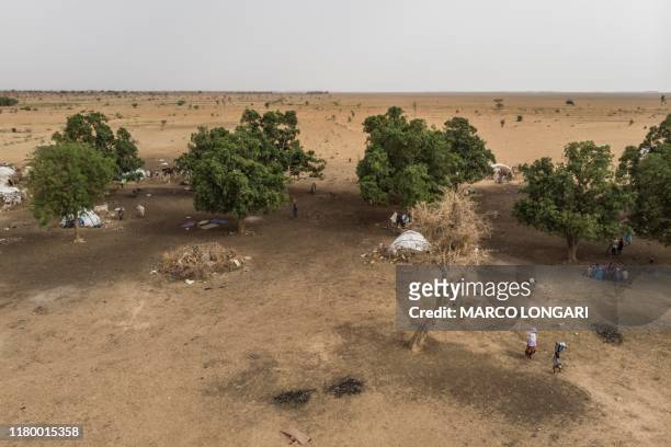This aerial view taken on July 8, 2019 shows the desert area outside an informal camp in Banguetaba, on the outskirts of Sevare. - An area once used...