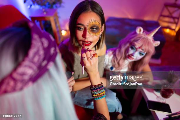 doing her best friend's make-up for halloween - period costume stock pictures, royalty-free photos & images