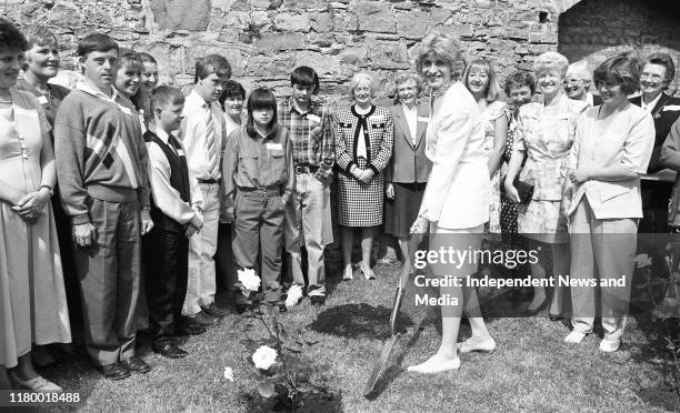 Ambassador Jean Kennedy Smith planting a tree at her residence in the Phoenix Park to celebrate her mother Rose Kennedy's 104th Birthday, .