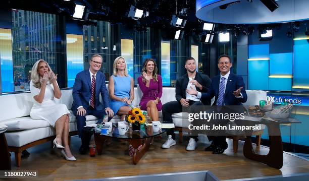 Fox anchors Janice Dean, Steve Doocy, Ainsley Earhardt, Jillian Mele and Brian Kilmeade are joined by Professional baseball player Tim Tebow during...