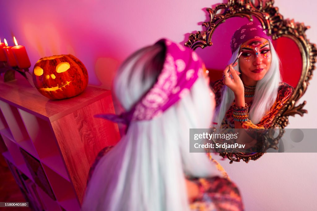 Putting the finishing touches to her Halloween costume