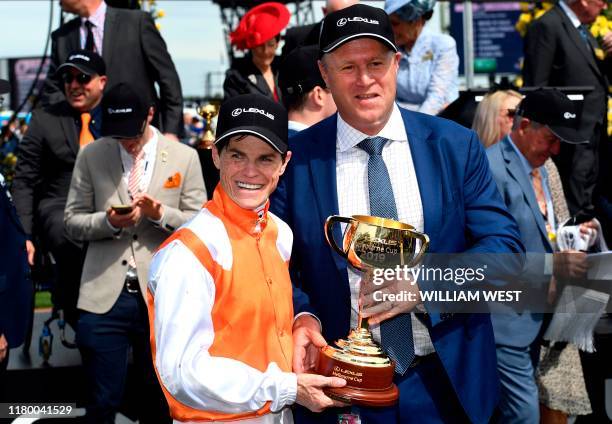 Jockey Craig Williams and trainer Danny O'Brien celebrate after winning the Melbourne Cup horse race with Vow and Declare in Melbourne on November 5,...